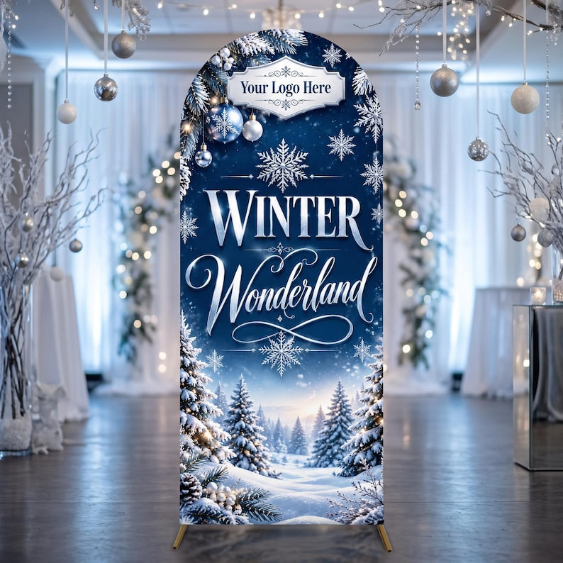 May include: An arched backdrop display featuring a deep blue winter landscape with snow-covered pine trees, white snowflakes, and silver ornaments. The text reads "Your Logo Here" at the top, followed by the words "WINTER Wonderland" in white.