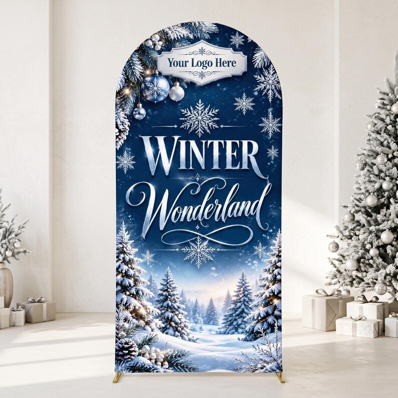 May include: An arched backdrop display featuring a deep blue winter scene with snow-covered pine trees, white snowflakes, and blue ornaments. The text reads "Your Logo Here" at the top and "WINTER Wonderland" in large, elegant white lettering.
