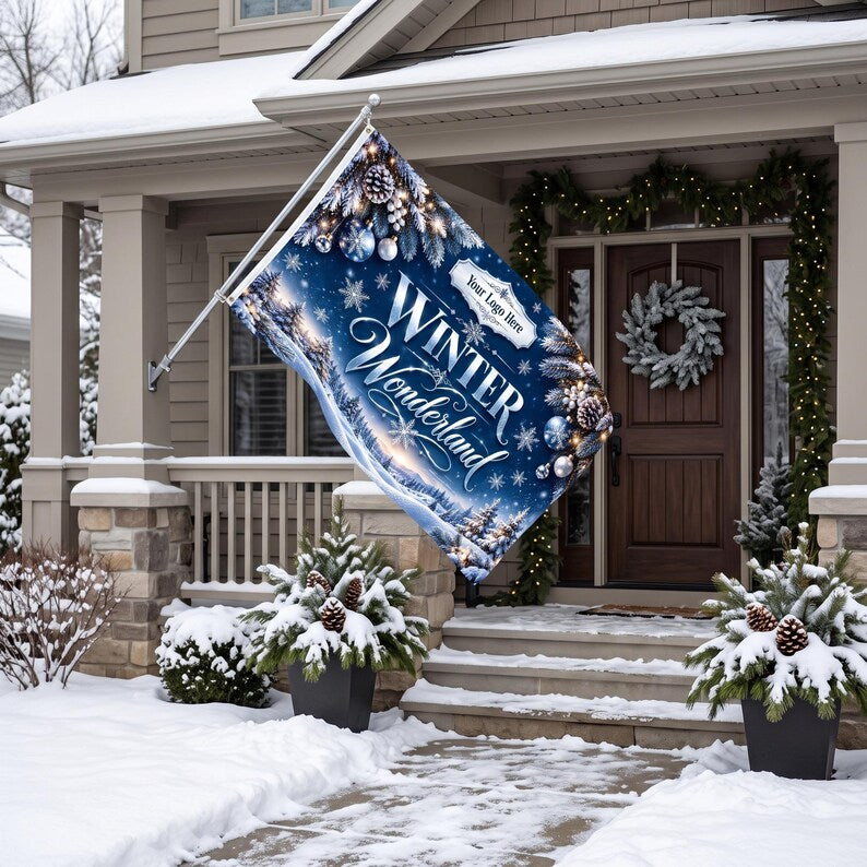 May include: A rectangular house flag featuring a deep blue winter landscape with snow-covered trees, pinecones, and silver ornaments. The text reads Winter Wonderland with a placeholder for a logo. The flag is mounted on a metal pole.